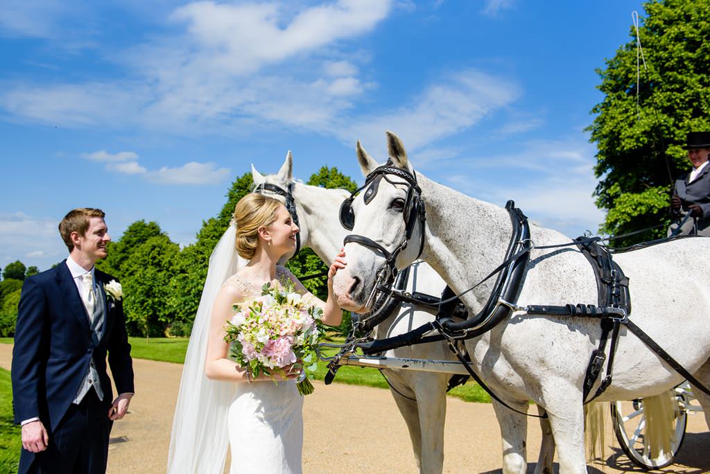 HORSE DRAWN CARRIAGE AT HATFIELD HOUSE WEDDING PHOTOGRAPHY 