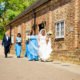 Bride walking to her Tewinbury wedding in Hertfordshire