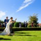 Bride playing garden games at Tewinbury wedding venue in Hertfordshire