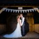 Bride and groom kiss at Tewinbury wedding venue in Hertfordshire