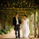 bride and groom walking at hatfield house