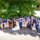 wedding guests pose at The Riding School Hatfield house wedding in hertfordshire