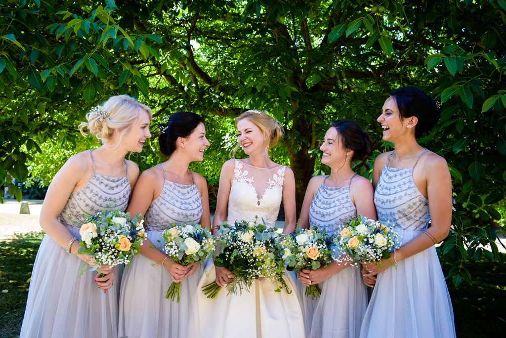 bridesmaids pose at The Riding School Hatfield house wedding in hertfordshire