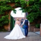 bride and groom walk back to their wedding at The Riding School Hatfield house wedding in hertfordshire