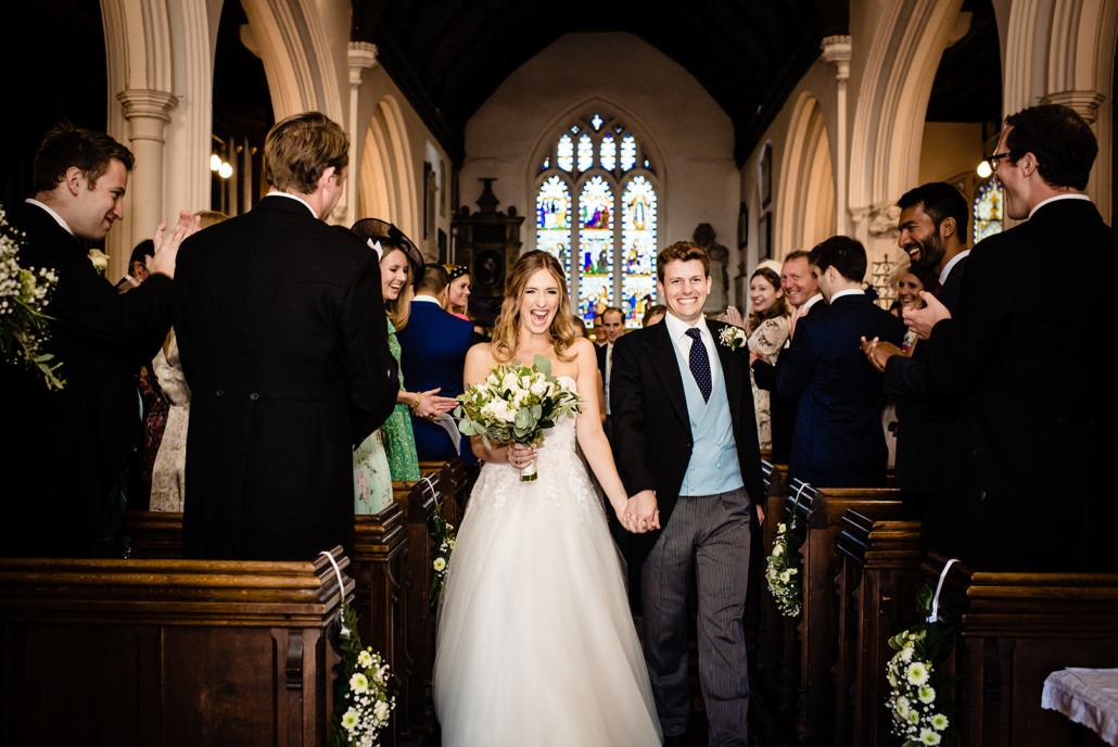 bride and groom exit their Barnet church wedding
