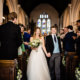 bride and groom exit their Barnet church wedding