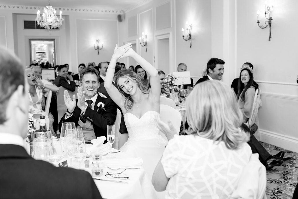bride laughing at wedding speeches at Dyrham Park Country Club Barnet