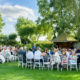 guests wait for bride at Autumn wedding at South Farm, Hertfordshire