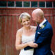 bride and groom laugh together at Autumn wedding at South Farm in Hertfordshire