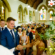 bride and groom say vows at Ayot St Lawrence church in Hertfordshire