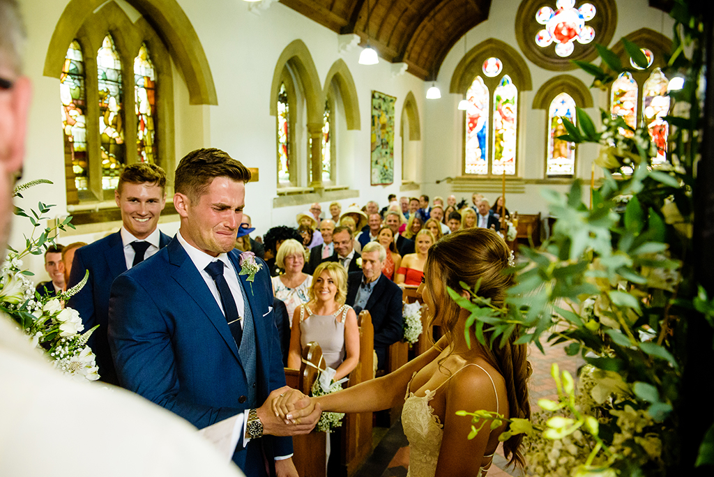 bride and groom say vows at Ayot St Lawrence church in Hertfordshire