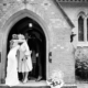 guests congratulate bride at Ayot St Lawrence church in Hertfordshire