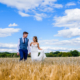 bride and groom walk in hertfordshire countryside