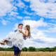 bride and groom pose in hertfordshire countryside