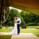bride and groom kiss at their hertfordshire tipi wedding