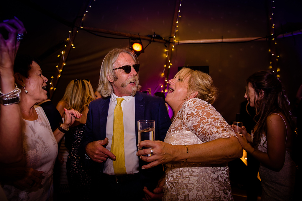 guests dance at tipi wedding reception in hertfordshire