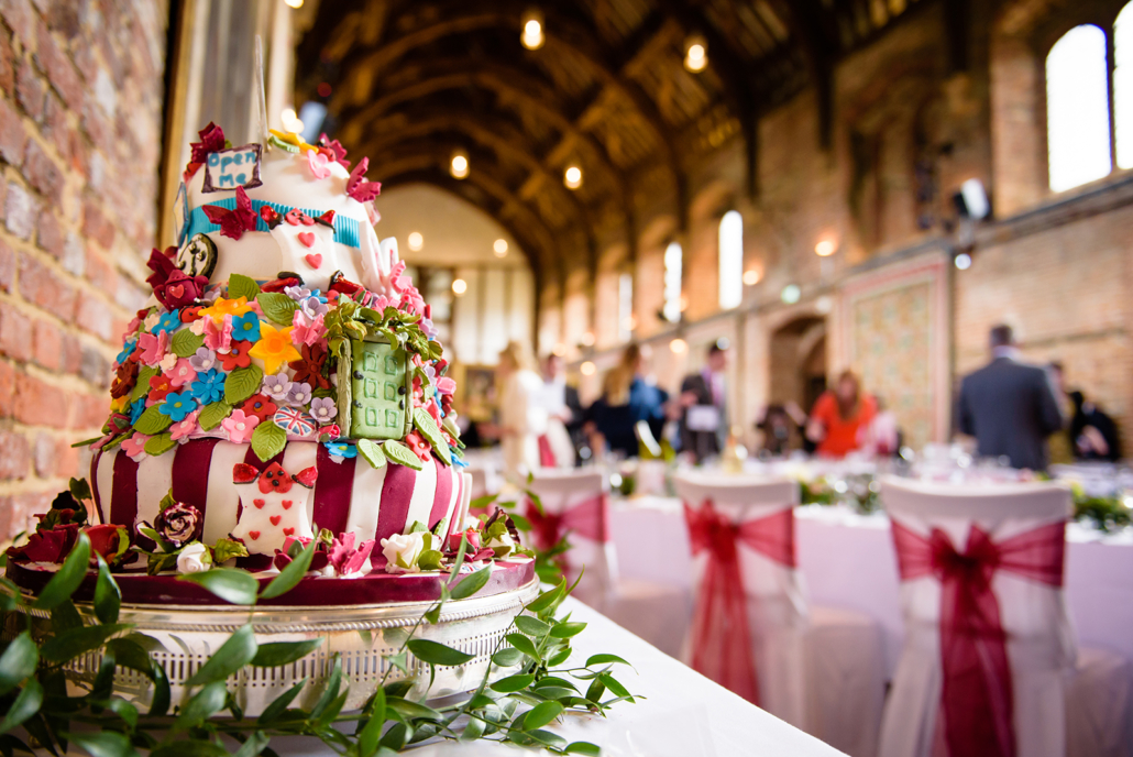 Alice in wonderland themed wedding cake at Hatfield House wedding in Hertfordshire
