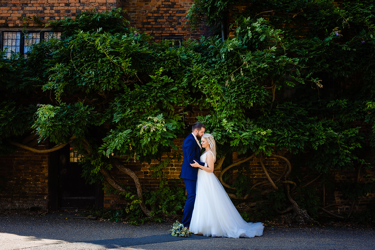 bride and groom at Hatfield house in hertfordshire