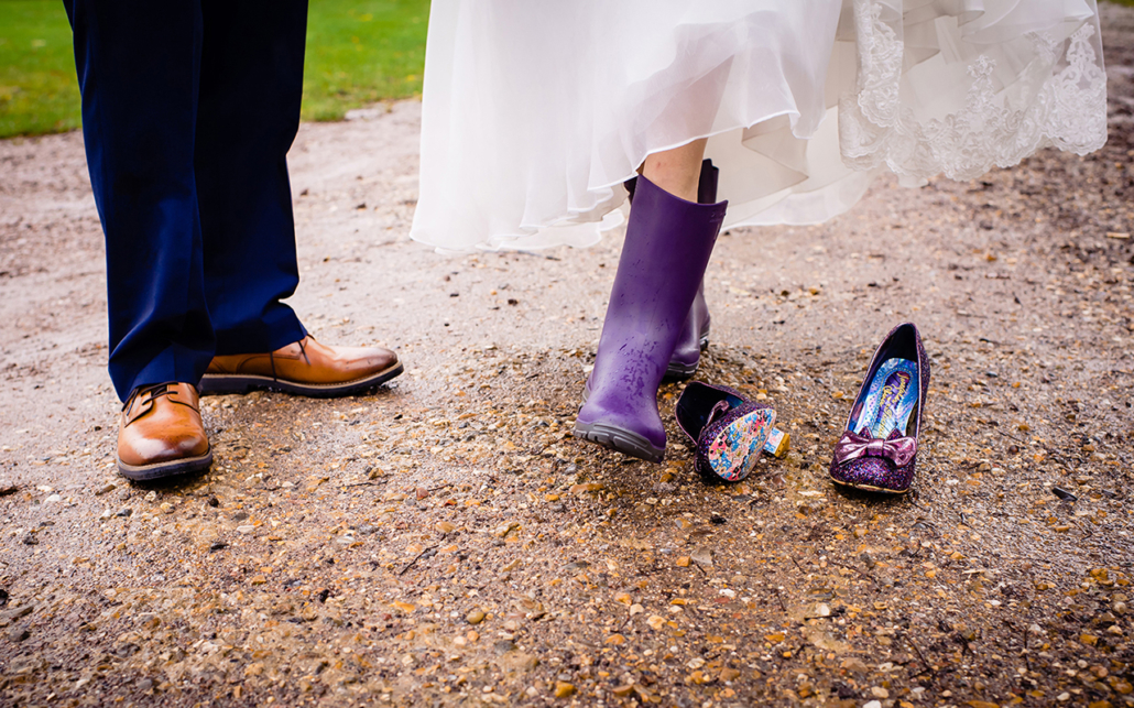Bride in her welly boots for a rainy wedding day in hertfordshire