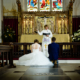 bride and groom at their wedding ceremony at St Elthandreds church in hatfield, Hertfordshire