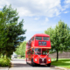 red bus takes wedding guests to chesfield downs wedding venue in hertfordshire