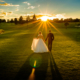 bride and groom walk towards sunset at chesfield downs wedding venue in hertfordshire