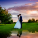bride and groom kiss at chesfield downs wedding venue in hertfordshire