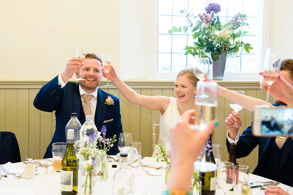 Wedding toast at Hastoe village Hall in Hertfordshire