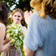 bridesmaid accidentally catches bouquet at Hastoe village Hall in Hertfordshire