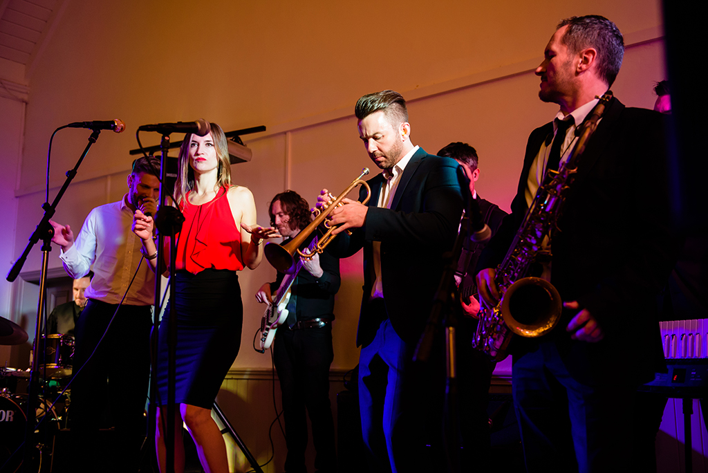 band plays at wedding reception at Hastoe village Hall in Hertfordshire