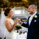 Bride and Groom toast a drink at Milling Barn wedding venue in Hertfordshire