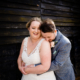 Bride and Groom hug at Milling Barn wedding venue in Hertfordshire