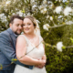 Bride and Groom pose in the grounds of Milling Barn wedding venue in Hertfordshire