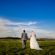 Bride and Groom walking the grounds of at Milling Barn wedding venue in Hertfordshire